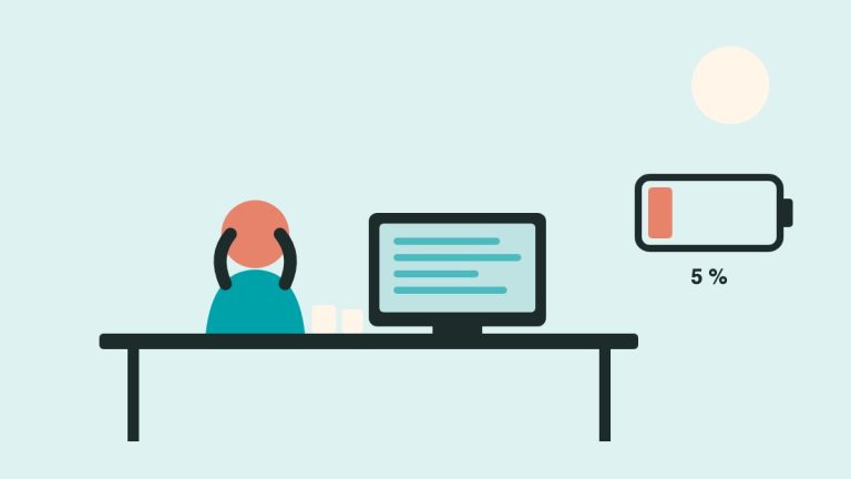 Illustration : une personne épuisée à son bureau, à côté d’une batterie presque vide